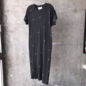 Black cotton dress with embroidered pink roses.